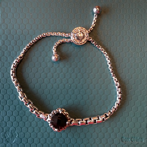 Jai sterling silver adjustable bracelet with dark amethyst gem stone.